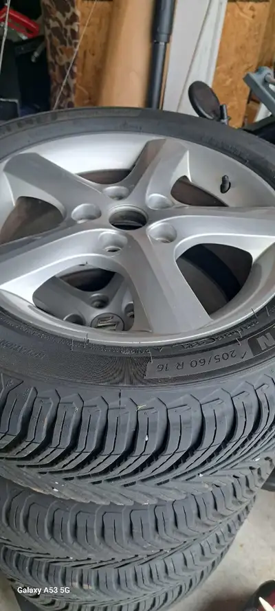 Michelin Cross Climate 2 tires (4) on OEM Suzuki SX4 16" Alloy rims. Tires are 205/60R16 and have le...