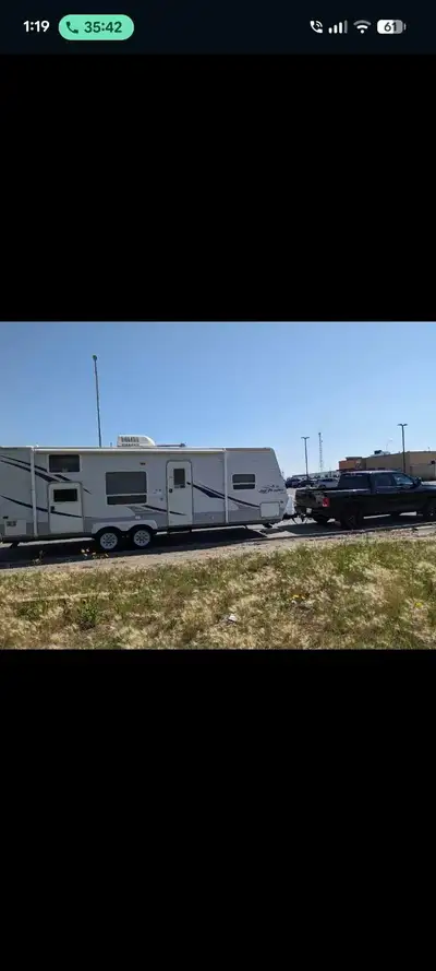 Beautifully maintained 27' bunk house. Sleeps 8. Queen bed, fold down table, pull out sofa and bunks...