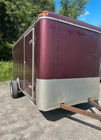 2006 enclosed trailer with ramp / barn rear door. Trailer has a side door to no leaks. 2" ball plywo...