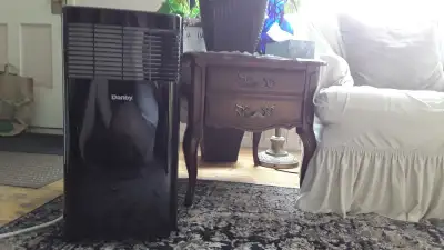 Air conditioner portable almost new 10 000 B T U on wheels, View more