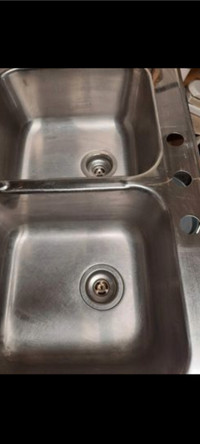 Kitchen sink with double handle faucet