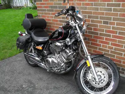 New battery and many extras, 2 manuals, 2 covers, second slash cut exhaust, saddlebags. Needs clutch...