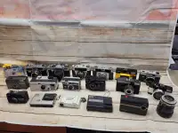 Lots of film camera stuff. Everything for $80. Untested.