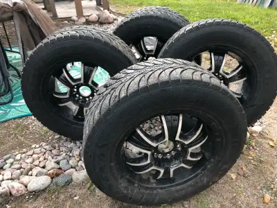 Full set of 31” Winter studded Goodyear tires (UltraGrip Ice) (265/65R20) with 20” American Racing r...