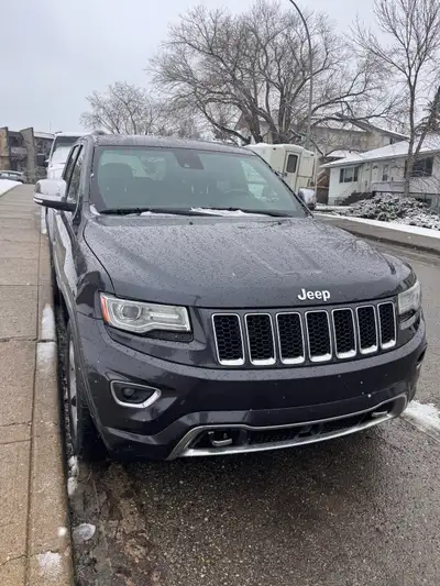 2014 Jeep Grand Cherokee. Brown and Blue Leather Interior with Brown Dashboard trim. Tow package. Ov...