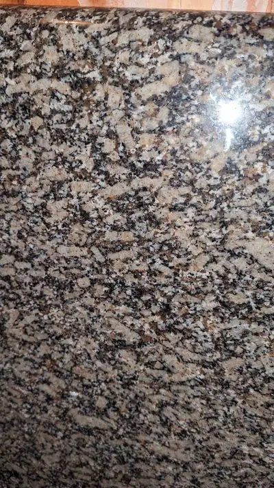 This is a used granite countertop, perfect for adding a touch of elegance to your kitchen or bathroo...