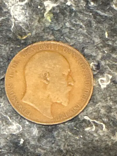 This is a 1906 British one penny coin featuring King Edward VII, a neat piece of history in your han...