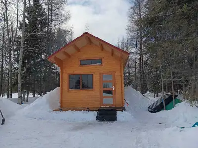 Great opportunity in a new and rising Off-Grid Community! Turn Key Tiny Home on Half Acre Lot. Wood...