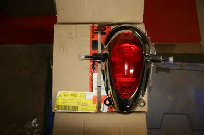 Genuine OMB taillight assembly, 3 new reflectors, windscreen hardware, cruise control, new l-plate ,...