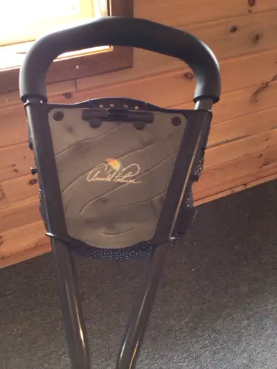 This is a used Arnold Palmer PGA golf cart with three wheels, perfect for golfers looking for a ligh...