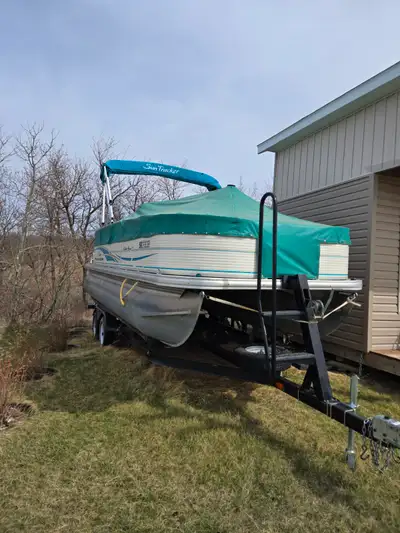 Comes with trolling motor 2 fish finders fishing rod holders 3 live wells new tarp and a dual axel t...