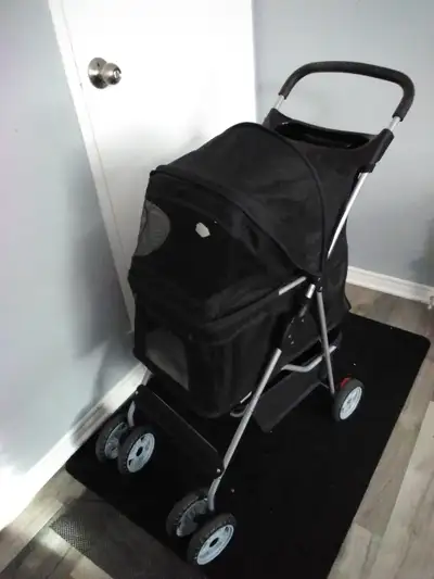 Dog stroller. Has been gently used for the last year for a 12lb dog. 86.4L x 45.7W x 99.1H centimetr...