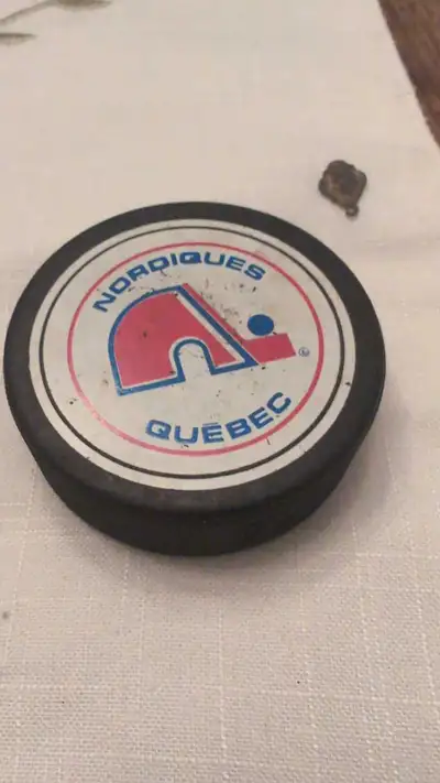 I'm offering a vintage Quebec Nordiques hockey puck. This puck is in used condition, showcasing the...