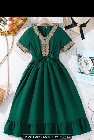 Dark green midi dress. Features gold lace detailing at neckline and sleeves. A-line silhouette. Come...