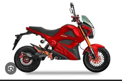 This sleek, red Daymak electric motorcycle is in great pre-owned condition and offers a stylish, emi...