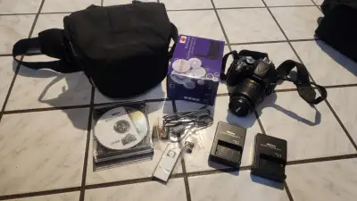 Nikon D5100 camera with 2 lenses and digital viewer screen. Was backup camera for studio photographe...