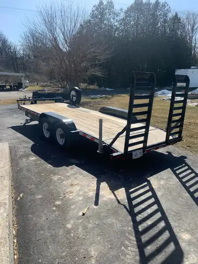 7ft x 20ft equipment trailer Rated for 14,000 pounds Spare tire Spring loaded ramps Year 2021 $7500...