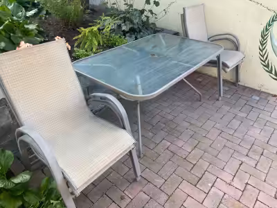 4 stacking chairs and glass top table (36 x 56 inches)