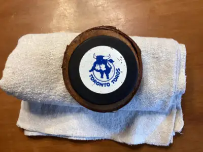 1973 WHA TORONTO TOROS GAME USED PUCK on wood display !, View more