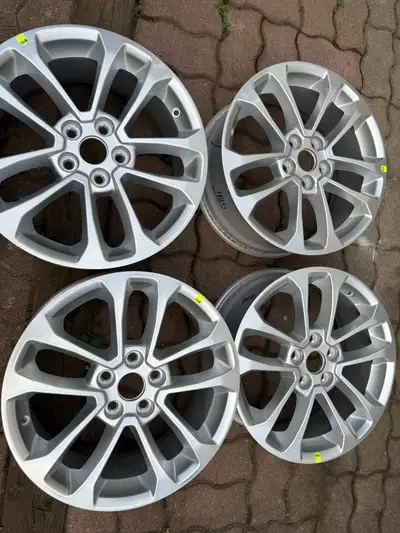 I am selling a set of four used Ford Escape rims with a 5x108 bolt pattern and a 17-inch diameter, a...