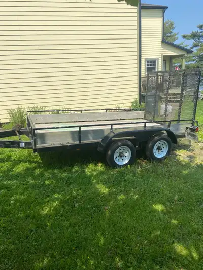 This is a used 6x10 utility trailer, ready for all your hauling needs! It features a sturdy frame an...