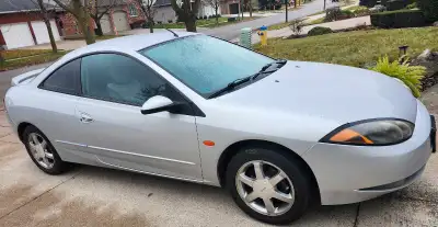 1999 Mercury Cougar 5 speed V6 2.5 litre Cruise Air conditioning Power windows and door locks AM/ FM...