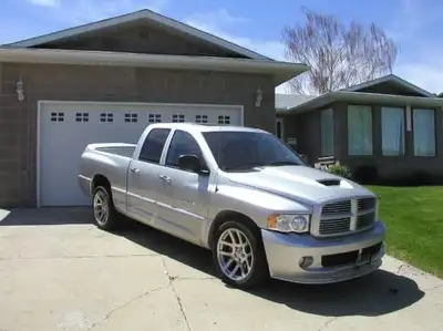 The following information is on a 2005 Dodge Ram SRT 10(Quad Cab) VIN# 3D3HA18H85G806887 ; Silver in...