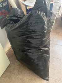 Garbage bag of kids clothes 