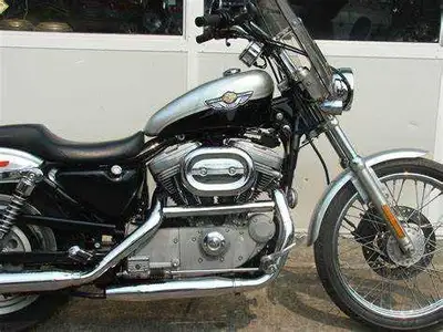 Own a piece of history with this 2003 Harley-Davidson Sportster 883 Custom Chopper, a 100th Annivers...