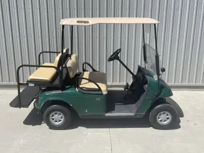 2003 Green EZGO TXT 36 Volt Electric Golf Cart, Rear seat and lights U#1107G $4,250 plus tax Located...