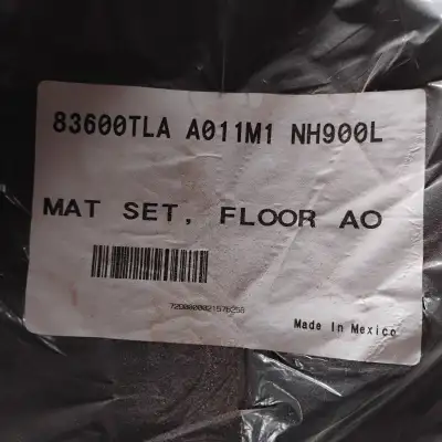 The part number 83600-TLA-A011 M1 refers to Honda CR-V carpet floor mats for the model years 2017 th...