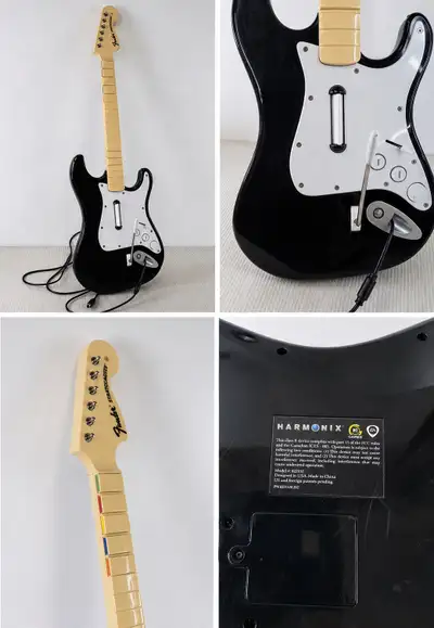 Fender Stratocaster-style guitar controller by Harmonix/EA. Black body with white pickguard. Include...