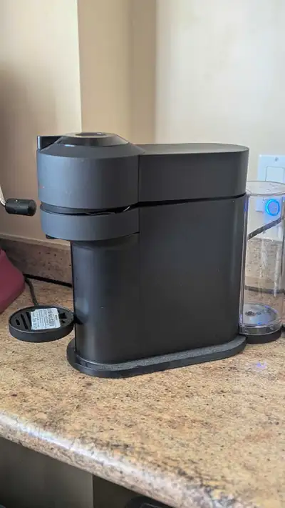 Like new, used for less than a year. It comes with its original box and manual. Uses Nespresso vertu...