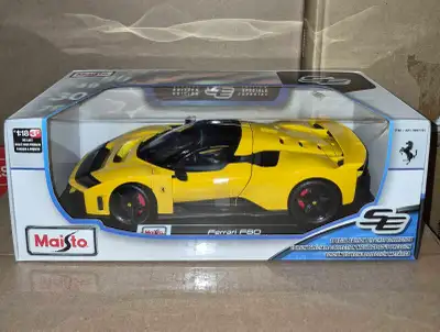 This Maisto Ferrari F80 $45 and 2005 Chrysler HEMI 300C $50, 1:18 scale Special Edition die-cast mod...