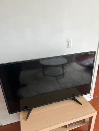 Selling Toshiba 49 inch TV for $130(With TV table), View more