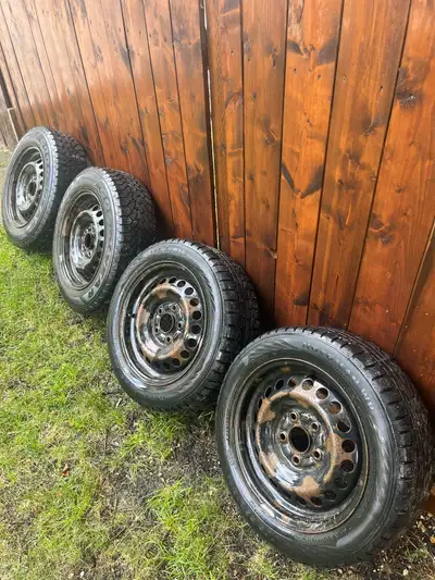 Winter tires on rims with honda hubcaps 2 goodyear nordic winter 195 / 65R15 2 nordman wr 195 / 55R1...