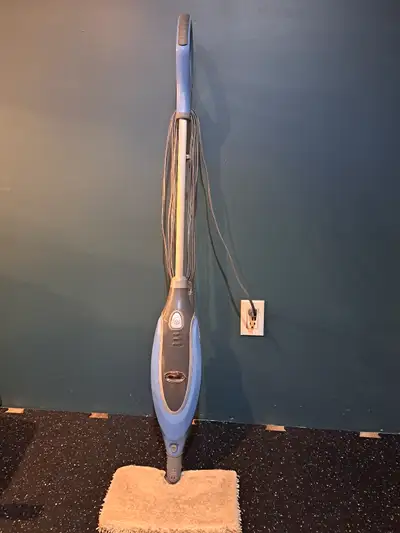 Shark steam mop with extra large tank. Heats up nicely, only used with distilled water. Comes with p...