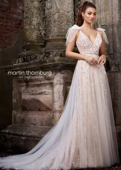 I'm selling a beautiful Martin Thornburg wedding dress, perfect for your special day! This gown feat...