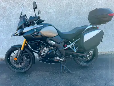 Bike includes factory center stand and hard bags. Options are Givi top box with adapter plate. Oxfor...