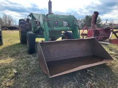 John Deere 1030 tractor. Features front-end loader. Approximately 2386 hours. Great for farm work or...
