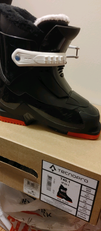 Boy skiing boots $43, View more