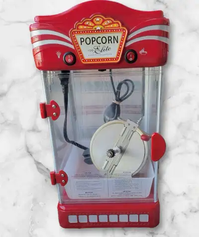 Elite Popcorn Machine, great for gatherings or parties. The one side of plexi glass does have a crac...