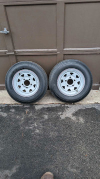 Pair of trailer tires on rims 