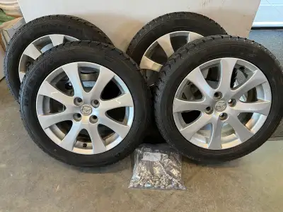 These pre-owned 185/55R15 Rovelo winter tires and genuine Mazda rims are in great used condition. Th...