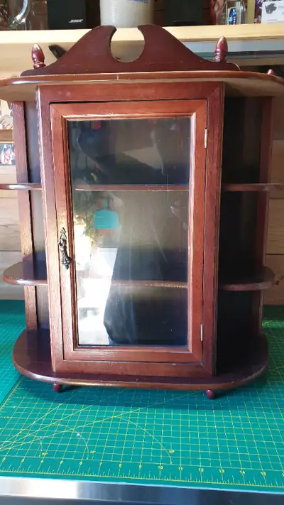 A unique twist on a wall display or shelf, this wall curio cabinet is a great way to display your ch...