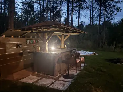 Escape to the country with this charming house on a sprawling 25 acres! The photos showcase a rustic...