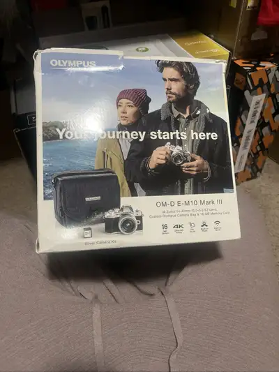 Capture stunning photos with this Olympus OM-D E-M10 Mark III Silver Camera Kit, featuring a M.Zuiko...