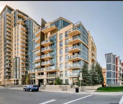 West-facing corner suite at Riverfront Pointe, Downtown Calgary, with Bow River and city skyline vie...