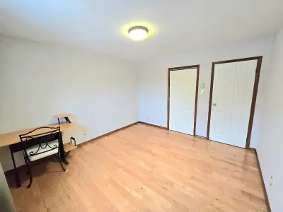 Available for Rent February 2026 Bright and modern room featuring hardwood floors, clean white walls...
