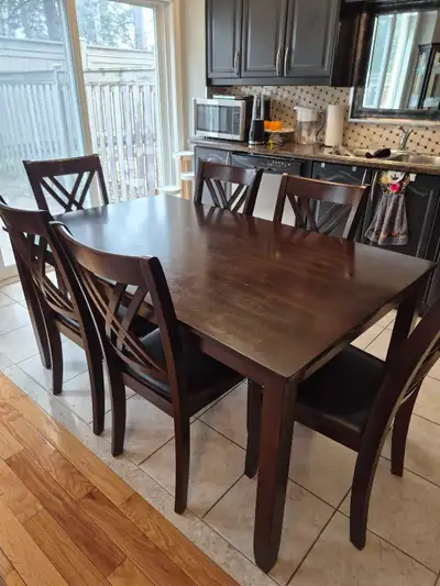 Dinning table with 6 leather chairs new and in great condition, View more